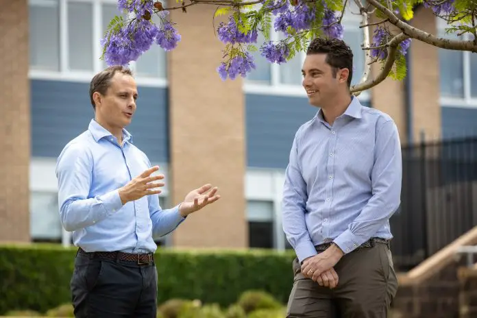 Thomas Griffiths, BaptistCare NSW and ACT, with Byron Serjeantson, Flow Power, discuss the PPA agreemen (1)