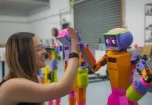 Andromeda Co-founder Grace Brown with Abi the robot.
