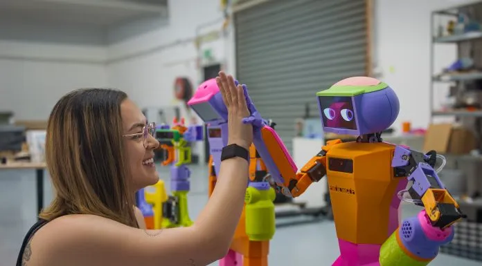 Andromeda Co-founder Grace Brown with Abi the robot.